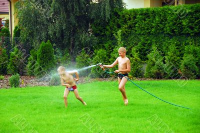 boys play on the grass