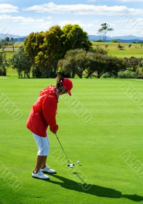 putting on golf green