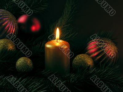 Christmas ornaments and burning candle Christmas ornaments and burning candle