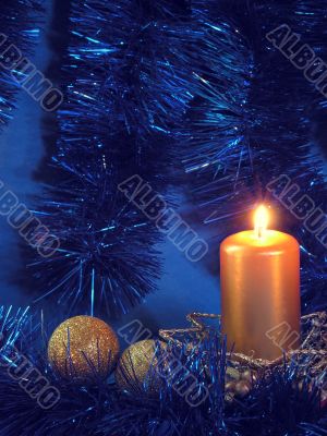 burning gold candle about Christmas tree burning gold candle about Christmas tree