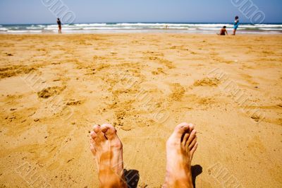 man relaxing at the beach
