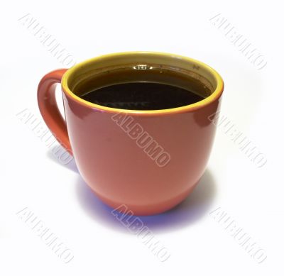 glazed pottery cup of coffee
