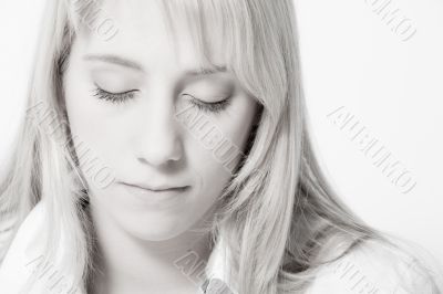 Studio portrait of a long blond girl relaxing Studio portrait of a long blond girl relaxing