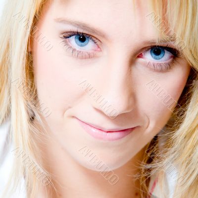 Studio portrait of a long blond girl looking friendly Studio portrait of a long blond girl looking friendly