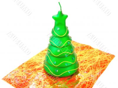 new-year candle in form the decorated fir-tree on a white backgr