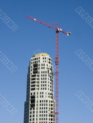Red Crane on Construction Tower
