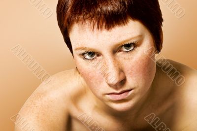 Studio portrait of a serious looking young woman with short hair