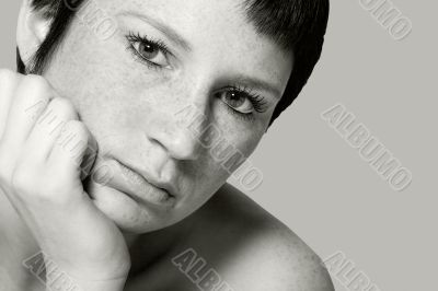 Studio portrait of a bored young woman with short hair