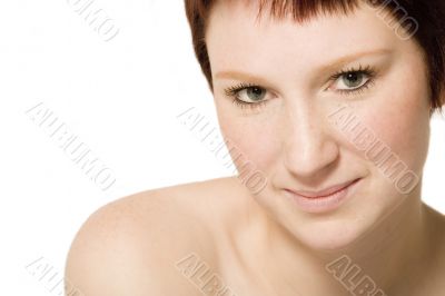 Studio portrait of a flirting young woman with short hair