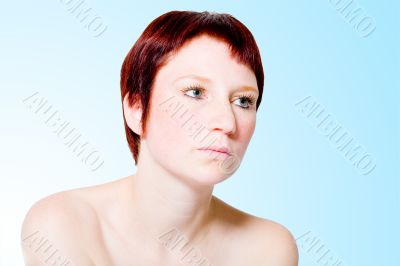 Studio portrait of an uninterested young woman with short hair
