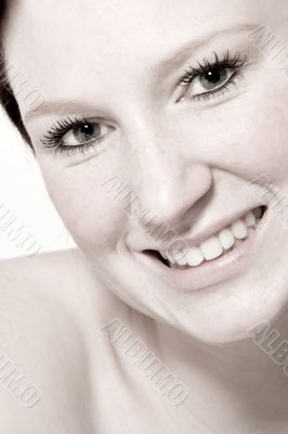 Studio portrait of a young woman with short hair flirting