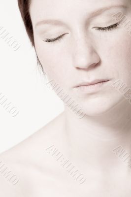 Studio portrait of a young woman with short hair relaxing
