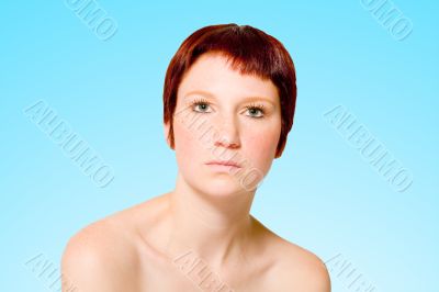 Studio portrait of a neutral looking young woman with short hair