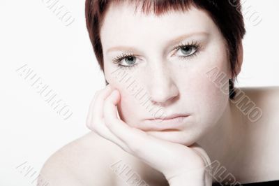 Studio portrait of a bored young woman with short hair