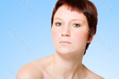 Studio portrait of an uptight young woman with short hair