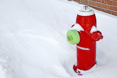 Red fire hydrant in the snow