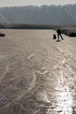 People skating on natural ice