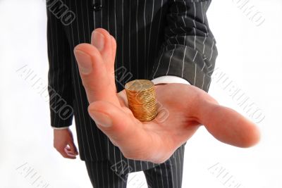  businessman holds  pile of coins