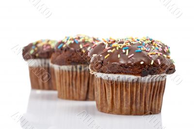 Three tasty muffin with chocolate Three tasty muffin with chocolate