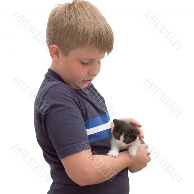 boy cuddling his pet kitten