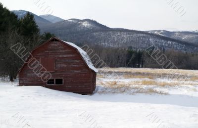 old snow covered barn