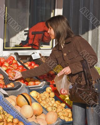 Woman buying fruits