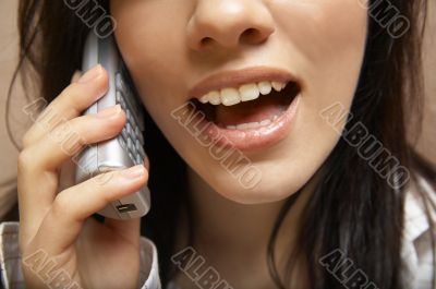 young woman is speaking on cell phone