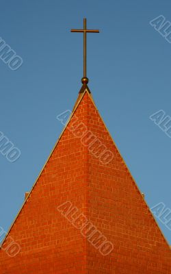 The top part and cross of Catholic church.