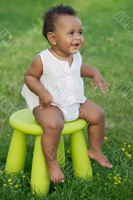 Toddler playing with chair