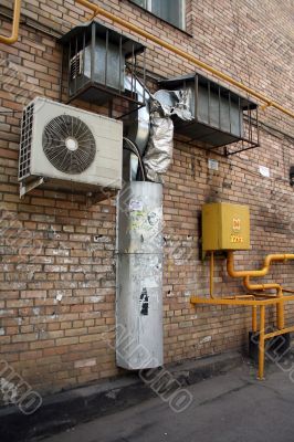 air conditioner on the brick wall with airshaft