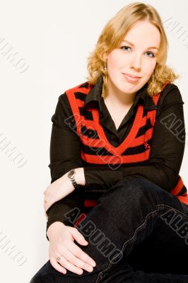 Portrait of a blond curly woman making eye contact