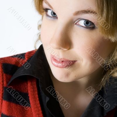 Portrait of an interested blond curly woman