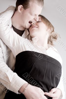 Portrait of a young biting loving couple
