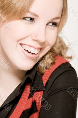 Portrait of a laughing blond curly woman