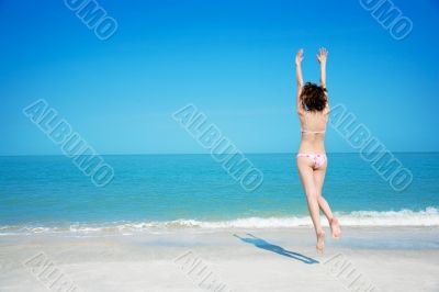 girl in bikini jumping girl in bikini jumping