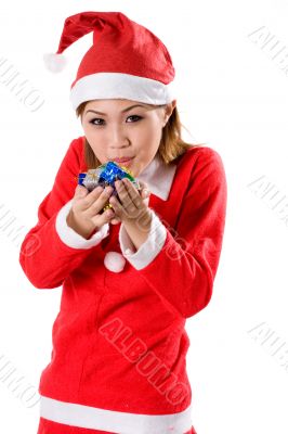 female santa blowing gifts
