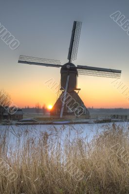 Dutch windmill in winter scene