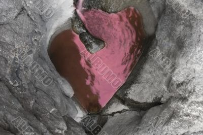 heart-shaped lake in rocks
