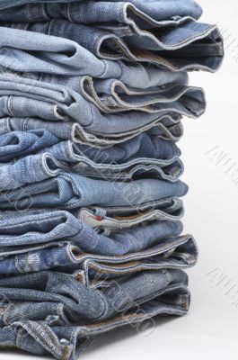 the heap of modern designer blue jeans