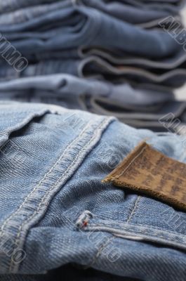 the heap of modern designer blue jeans