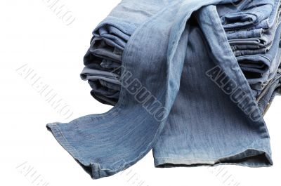 the heap of modern designer blue jeans