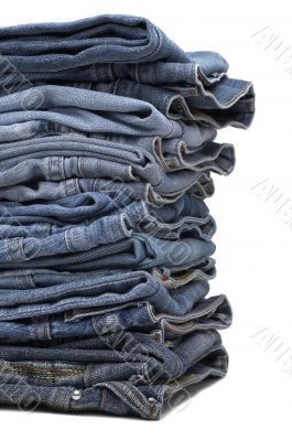 the heap of modern designer blue jeans