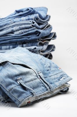 the heap of modern designer blue jeans