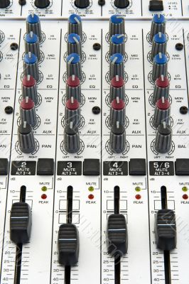 Faders and knobs of sound mixer