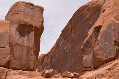 Two faces carved in stone by wind.