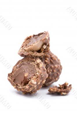 broken chocolate candies on white background