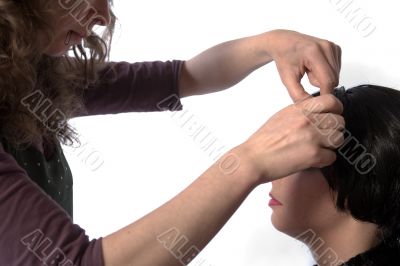 Hair dresser artist working on hair