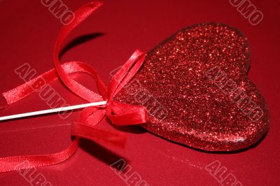 Red heart on red background
