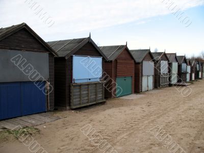 A row of beach huts during the winter months.