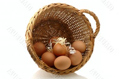  few eggs in basket with one decorated